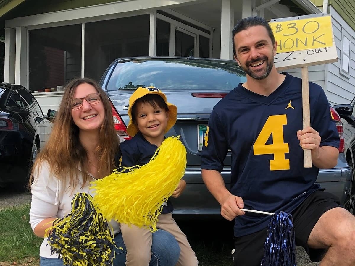 Family with parking sign